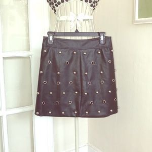 Black grommets + studs leather skirt